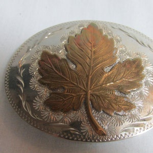 German silver oval belt buckle with bronze leaf overlay