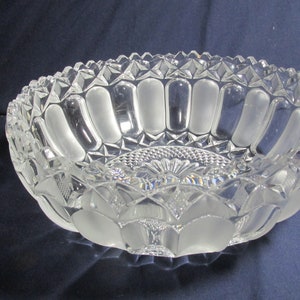 Crystal round serving bowl with frosted panels, saw-tooth edge, waffle and rayed star bottom