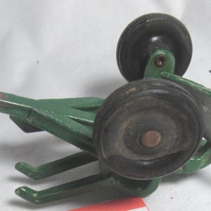 John Deere pull behind 2 row plow with rubber wheels, no plastic parts