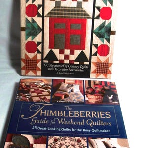 May include: Two quilting books with the title "Thimbleberries Quilts" and "The Thimbleberries Guide for Weekend Quilters". Both books feature colorful quilt designs and are by Lynette Jensen.