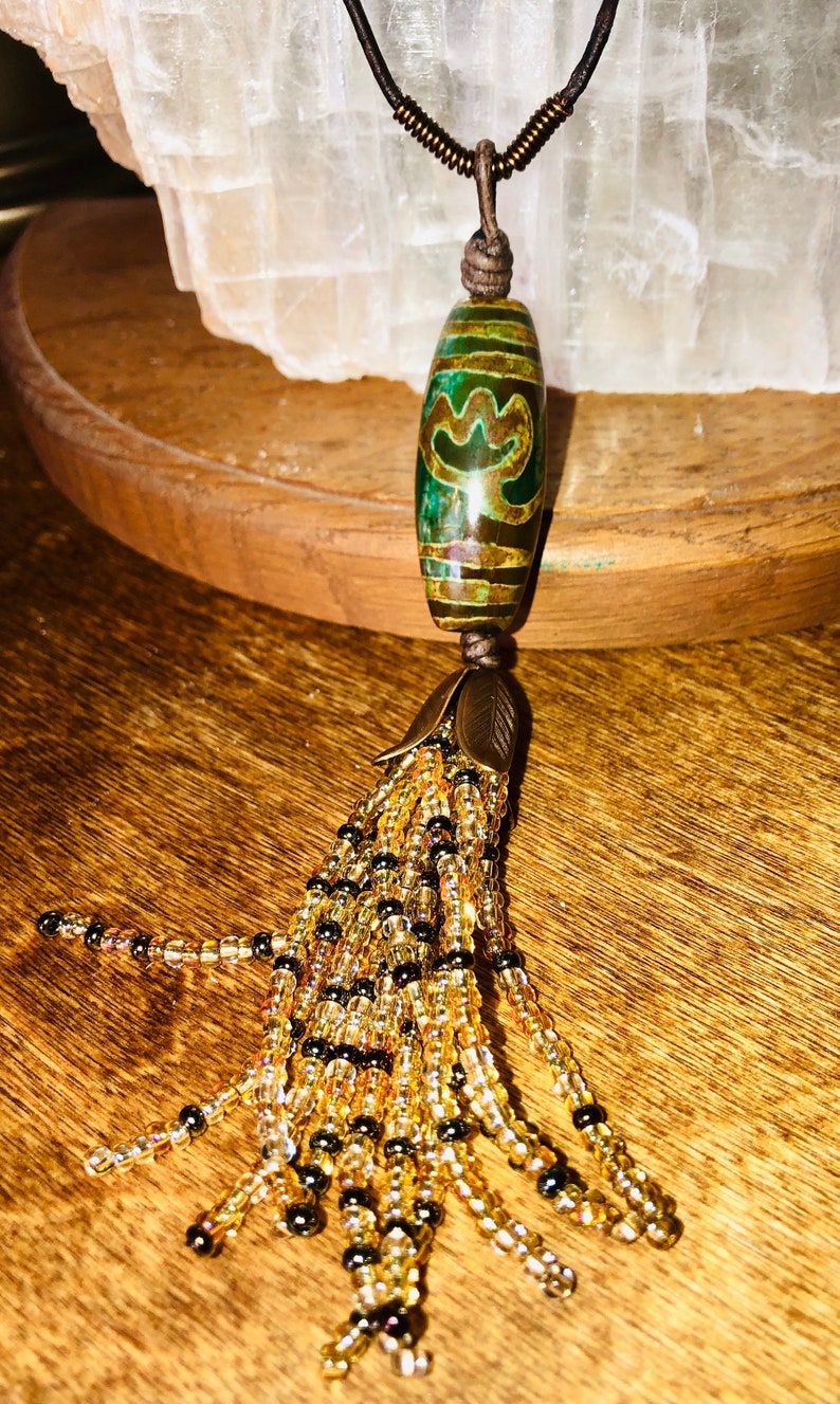Boho Style Long Adjustable Necklace with a Focal Dzi Style Green /& Bronze Bead with a Gold Tone Beaded Tassle on Dark Brown Natural Leather