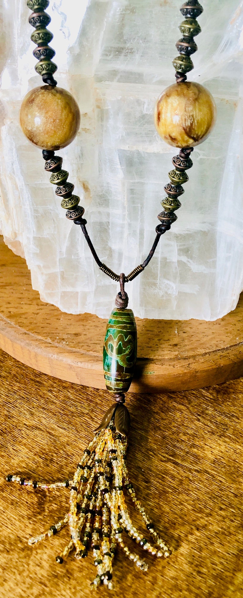 Boho Style Long Adjustable Necklace with a Focal Dzi Style Green /& Bronze Bead with a Gold Tone Beaded Tassle on Dark Brown Natural Leather
