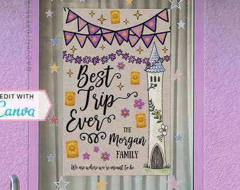 May include: A framed print with the text "Best Trip Ever" and "The Morgan Family." The artwork features a tower, lanterns, and floral accents in purple, yellow, and white. The frame is a light purple color, and the background has star-shaped decorations.