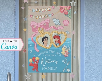 May include: A framed Disney-themed artwork featuring Ariel and Eric, with the text "Under the Sea with the Williams Family." The design includes a pink bow, seashells, and stars. The frame is light blue.