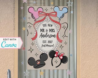 May include: A rectangular window decal featuring a central oval frame with a pearl border, a red bow, and the text THE NEW MR. & MRS. Anderson EST. 2027 Just Married. It includes pink and blue mouse-shaped balloons, mouse ears, and stars.