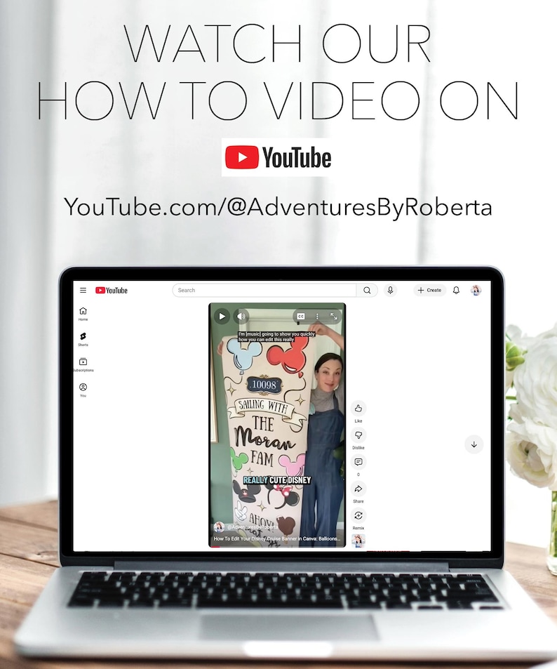 May include: A laptop screen shows a YouTube tutorial video. The video features the text "SAILING WITH THE MORAN FAM" and "REALLY CUTE DISNEY". The laptop is on a wooden table, with text above it saying "WATCH OUR HOW TO VIDEO ON YouTube.com/@AdventuresByRoberta".
