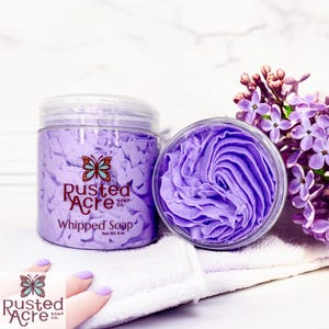 Two jars of purple lilac whipped soap handmade by Rusted Acre Soap Co.