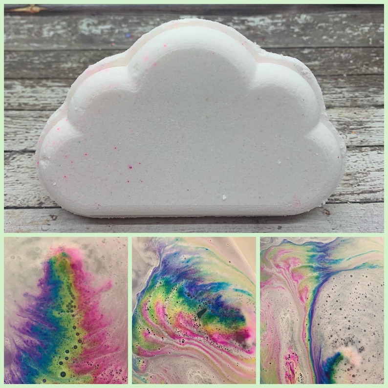 A white rainbow cloud bath bomb handmade by Rusted Acre Soap Co. on a rustic background.