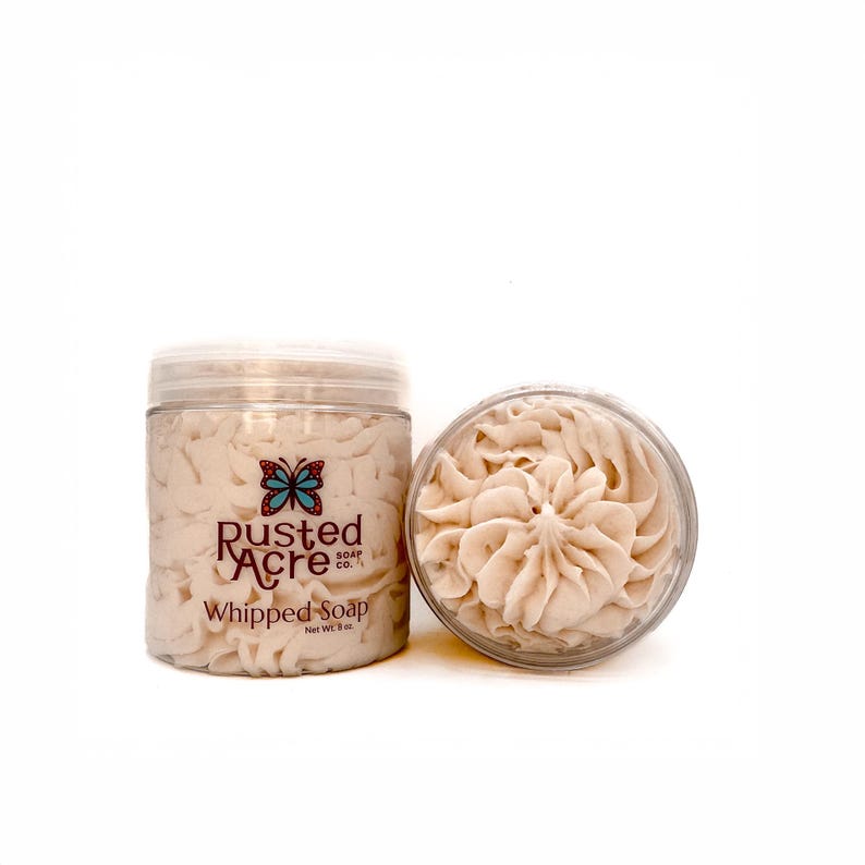 Two jars of whipped soap handmade by Rusted Acre Soap Co. beige in color.