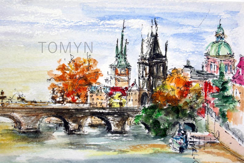 May include: Watercolor painting of a bridge over a river with buildings and trees in the background. The buildings have pointed roofs and the trees are in shades of orange and green. The painting is signed "TOMYN" in the upper left corner.