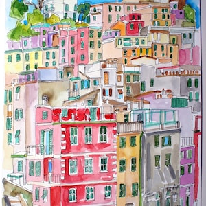 May include: Watercolour painting of a colourful cityscape with buildings stacked on top of each other. The buildings are painted in shades of pink, yellow, green, and blue. The painting is signed "Tomyn" in the top right corner and "Cinque Terre" in the bottom right corner.