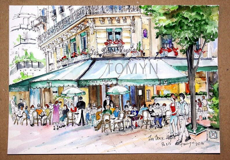 May include: A watercolor painting of a Parisian cafe with green awnings and people sitting at tables outside. The cafe is called "Les Deux Magots" and the painting is signed "Tomyn 7/2016".