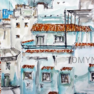 May include: Watercolor painting of a cityscape with blue and white buildings, red tile roofs, and a balcony. The painting is signed "Tomyn" in the bottom right corner.