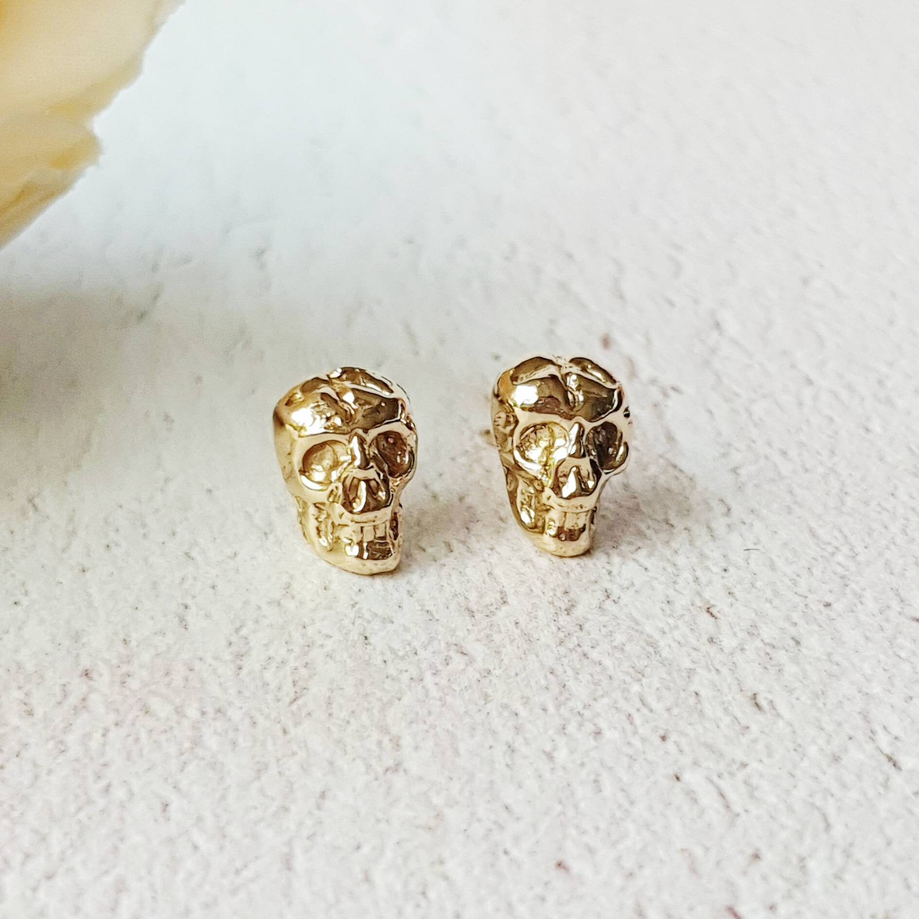 Gold skull earrings best sale studs