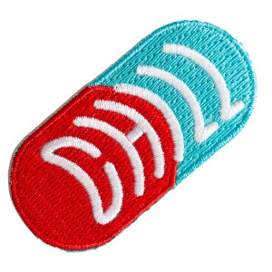 May include: Red and blue embroidered patch shaped like a pill with white wave-like designs on each side.