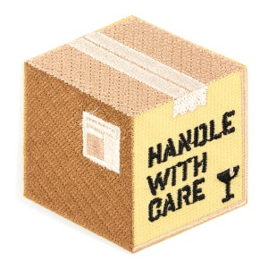 May include: A brown cardboard box with a yellow label that says "HANDLE WITH CARE" and a black cocktail glass icon.