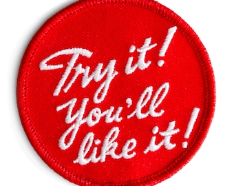 May include: Red round embroidered patch with white stitching that says "Try it! You'll like it!"