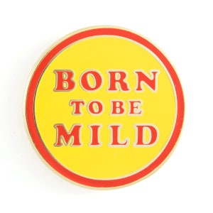 May include: A yellow and red round pin with the text "BORN TO BE MILD" in red letters.