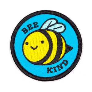 May include: A blue and black embroidered patch with a cartoon bee and the text "Bee Kind".