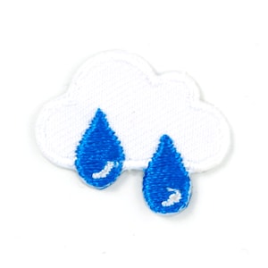 May include: White felt cloud with two blue felt raindrops hanging from it.