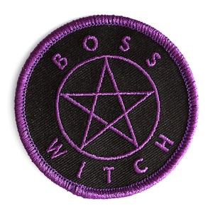 May include: Purple embroidered patch with a black background. The patch features a pentagram with the words "Boss Witch" surrounding it.