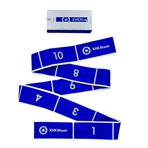 May include: Blue exercise resistance band with white numbers 1 through 10 printed on it. The band is rolled up and the text "KKN Miami" is printed on the band.