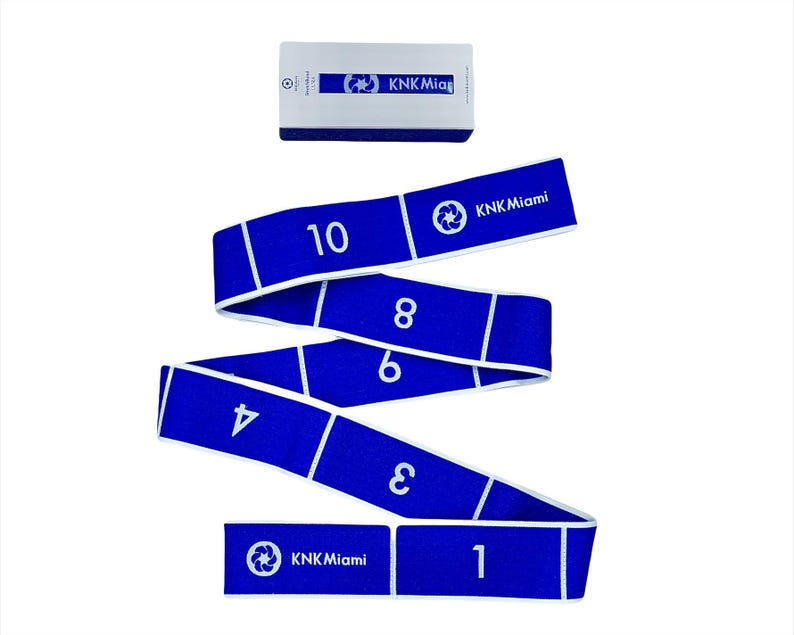 May include: Blue exercise resistance band with white numbers 1 through 10 printed on it. The band is rolled up and the text "KKN Miami" is printed on the band.