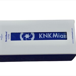 May include: A white box with blue trim and the text "StretchBand ULTRA" and "KNK Miami" on the front. The box is for a resistance band.