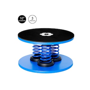 May include: A blue and black spring-loaded balance disc with a 10-inch diameter and 3 springs. The disc is designed for balance and core strengthening exercises.