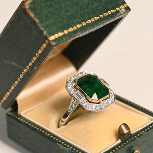 GIA Certified. 4center-ct Bezel Set Emerald Cut Emerald Ring. Halo of Diamond Ring. Handcrafted in Platinum with an 18K Yellow Gold Ring.