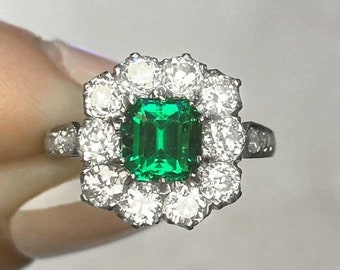 0.97ct Gubelin-Certified Emerald Cut Emerald Ring with a Halo Diamond Accent. Handcrafted Platinum Ring.