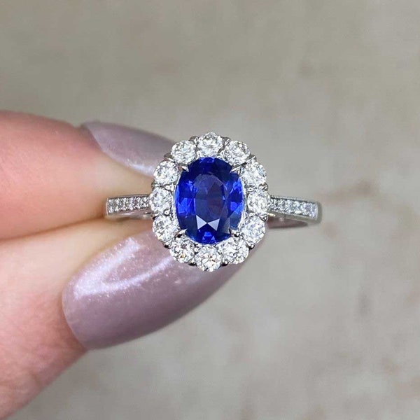 1.10ct Oval Cut Sapphire Ring with a Halo Diamond Accent. Platinum Ring.