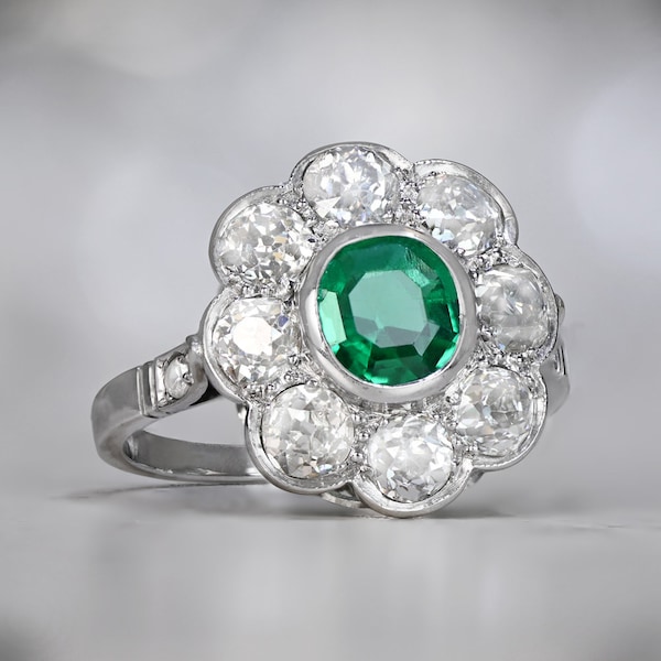 1ct Edwardian Style Oval Cut  Emerald Ring with a Halo Diamond Accent, Circa 1915. Handcrafted Platinum Ring.