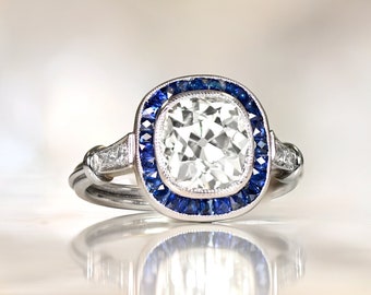 2.29ct Anrique Cushion Cut Diamond Ring with a Halo Sapphire Accent. Platinum Ring.