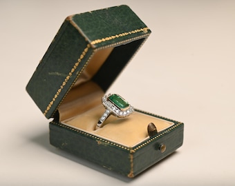 1center-ct Emerald Cut Emerald Ring. Gold Bezel Set and Halo Diamond Ring. Handcrafted in Platinum on an 18K Yellow Gold Ring.