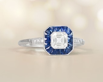 0.50-Carat Diamond Engagement Ring with French-cut Sapphire Halo Accent. Handcrafted Platinum Ring.