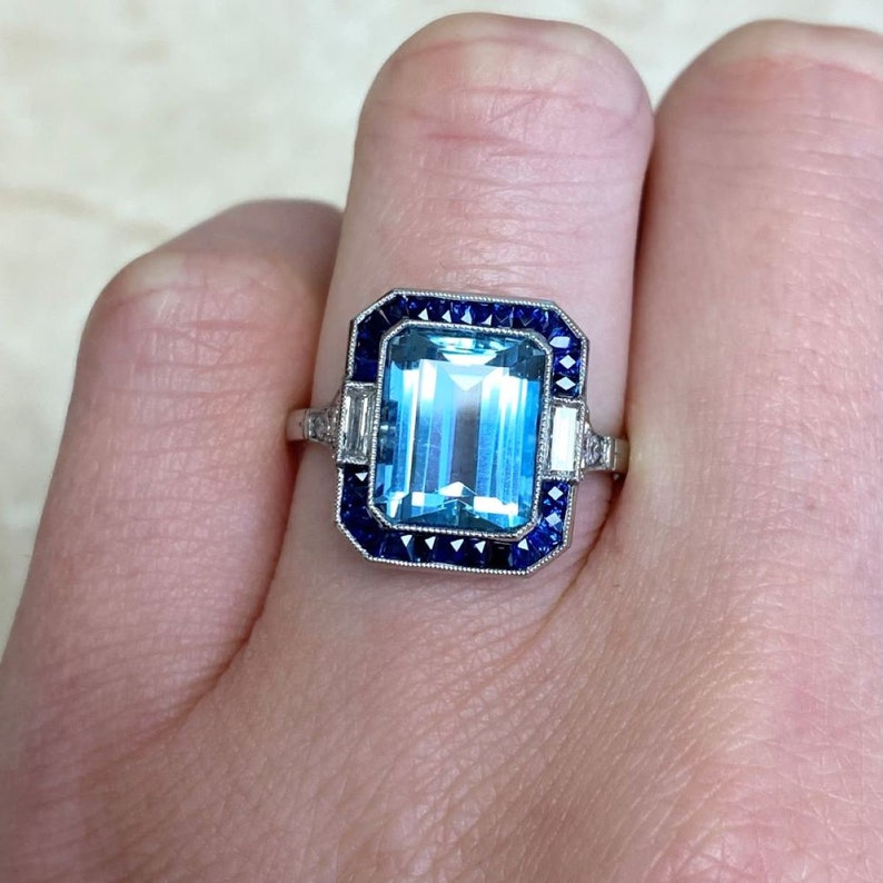 Emerald-Cut Aquamarine and Diamond Ring with Halo Sapphire Accent. Platinum Ring. image 7