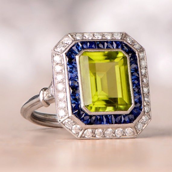 3.87ct Peridot Ring With Halo Sapphire and Diamond Accent