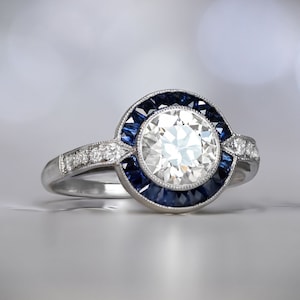 1.17ct Diamond Engagement Ring. Platinum Ring with Halo Sapphire Accent.