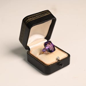 6.07center-ct Cushion Cut Amethyst Ring. Large Two Amethyst on Either Side Ring Accent with Scroll Motif. Made in 14K Yellow Gold Ring.