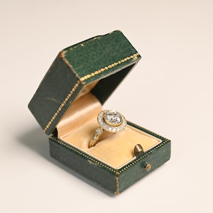 1.70ct Old European Cut Diamond Ring. Halo of Pave Set Diamond Ring, Circa 1920. 18K Yellow Gold Ring with I Color and SI2 Clarity.