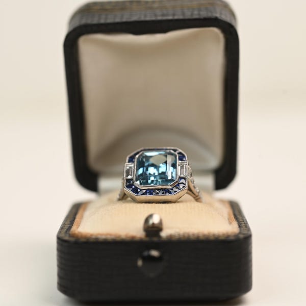 3.40center-ct Aquamarine Sapphire and Diamond Ring. Natural Emerald Cut with Halo of Sapphire Calibre Diamond Ring. Made in Platinum Ring.
