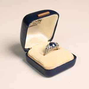 Three-Stone Sapphire Engagement Ring. 3.06center-ct GIA-Certified Cushion Cut Sapphire Ring set Triangular Prong. Handcrafted Platinum Ring.