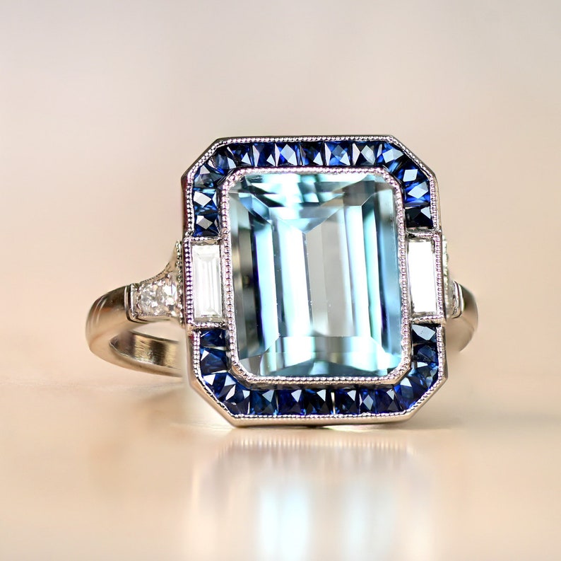 Emerald-Cut Aquamarine and Diamond Ring with Halo Sapphire Accent. Platinum Ring. image 1
