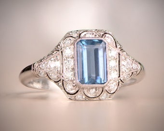 0.78 Carat Aquamarine and Diamond Halo Engagement Ring