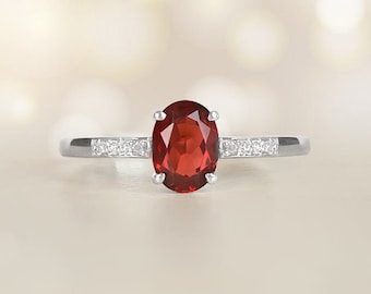1.67ct Oval Cut Ruby Engagement Ring. Platinum in 14K White Gold Ring.