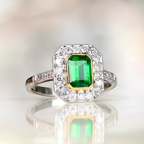 Emerald Engagement Ring. 1.03 Carat Emerald and Diamond Halo Engagement Ring. 18K Yellow Gold on Platinum Ring.