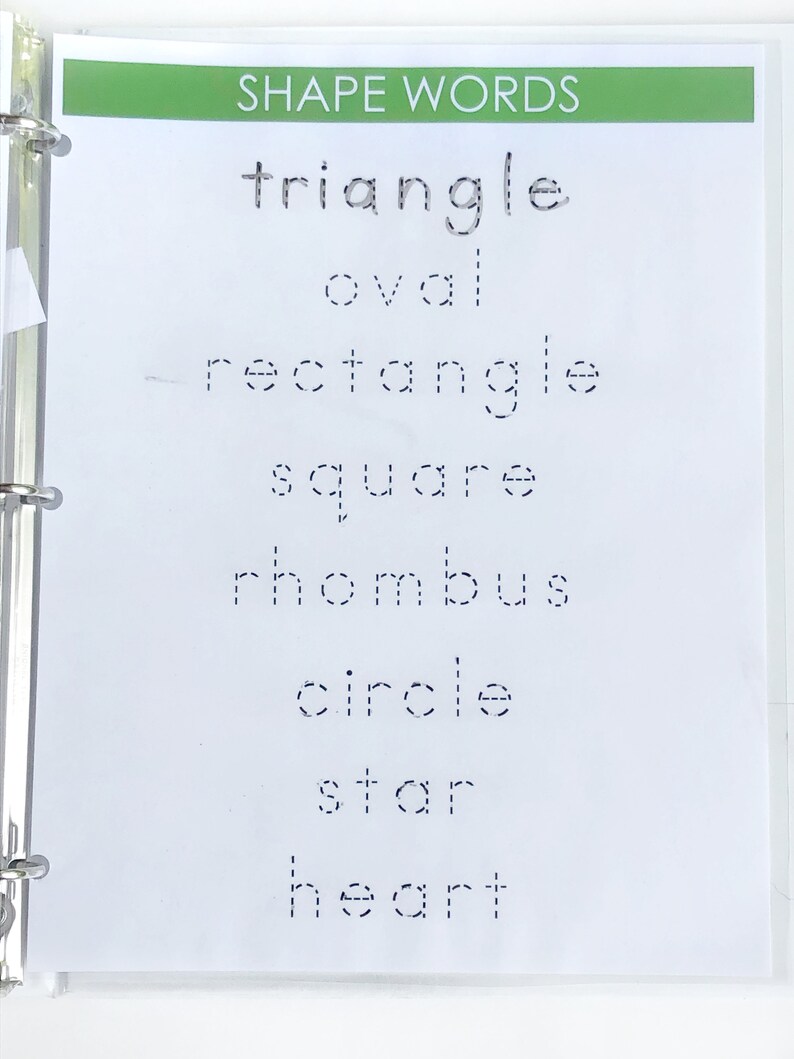 May include: A white page with the words "SHAPE WORDS" at the top. The words "triangle", "oval", "rectangle", "square", "rhombus", "circle", "star", and "heart" are written in dotted lines.