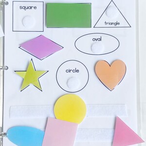 May include: A white board with the words "SHAPE MATCH" at the top.  There are different shapes with names below them: square, triangle, oval, circle.  There are also colorful shapes that can be matched to the outlines.