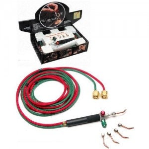 May include: A soldering iron kit with a black handle and a green and red hose. The kit includes a variety of tips and a small box with the text "The Little Soldering Station".